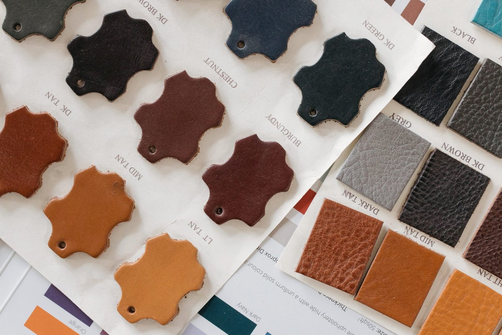 Leather sample swatches in several colours laid out.